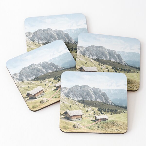 Item preview, Dolomites, Italy I Picturesque wooden chalets in the green Seceda mountains of an Alps landscape between lush green meadows, fir forests and pastel blue summer skies of preserved peaceful nature designed and sold by Julie Travel Photography.