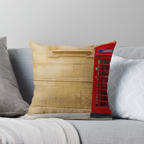 Item preview, Classic Red Telephone Booth Against Historic Stone Wall designed and sold by Nmallia.