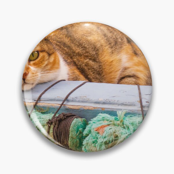 Item preview, Calico Cat Relaxing in Weathered Boat With Green Rope Outdoors designed and sold by Nmallia.