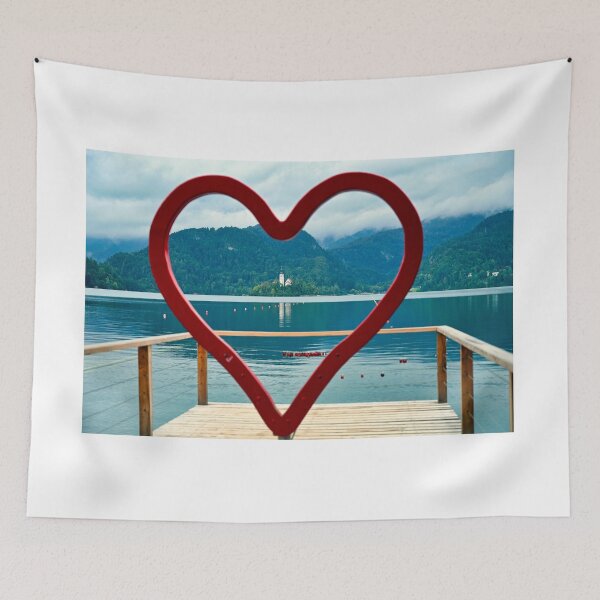 Item preview, View of the Pilgrimage Church of the Assumption of Maria Lake Bled through heart shape, Slovenia designed and sold by goceris.