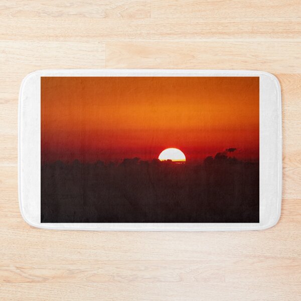 Item preview, Vibrant Sunset Over Horizon With Bright Sun Half-Visible Behind Dark Clouds and Horizon Glow designed and sold by Nmallia.