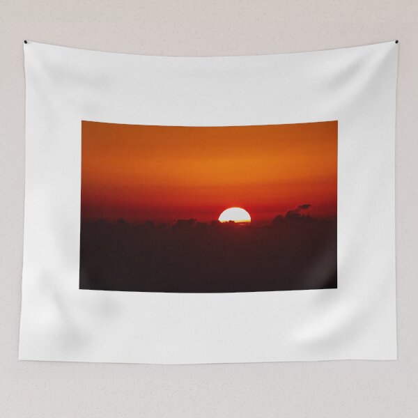 Item preview, Vibrant Sunset Over Horizon With Bright Sun Half-Visible Behind Dark Clouds and Horizon Glow designed and sold by Nmallia.