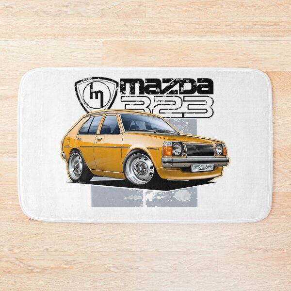 Artikelvorschau, Mazda 323 RWD Orange Fließheck Abbildung entworfen und verkauft von Petrolhead T-Shirts and Art.