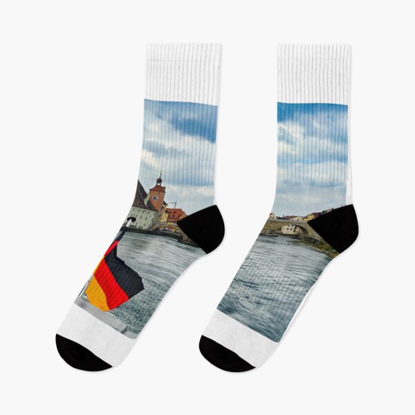Item preview, German flag and ancient stone bridge over the Danube river in Regensburg, Bavaria, Germany designed and sold by goceris.