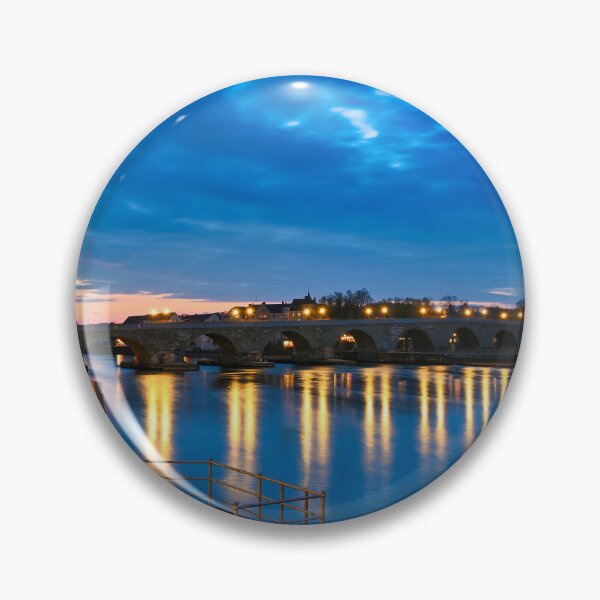 Item preview, Ancient stone bridge over the Danube river at night in Regensburg, Germany designed and sold by goceris.