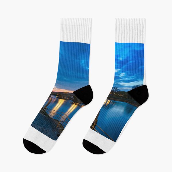 Item preview, Ancient stone bridge over the Danube river at night in Regensburg, Germany designed and sold by goceris.