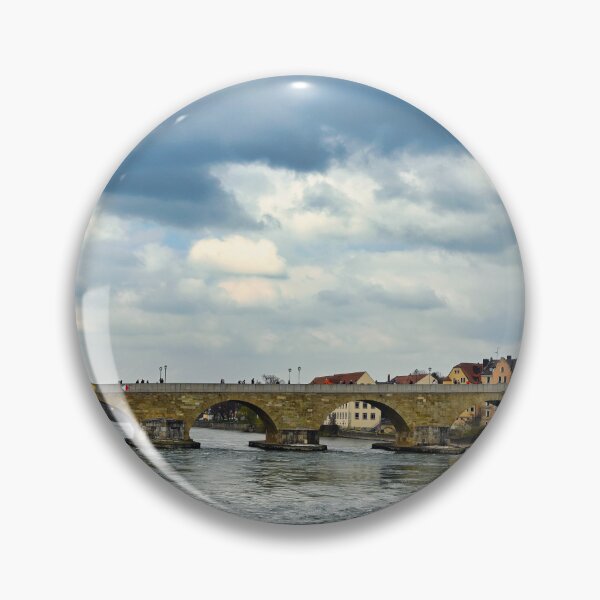 Item preview, Ancient stone bridge over the Danube river and clock tower in Regensburg, Bavaria, Germany designed and sold by goceris.