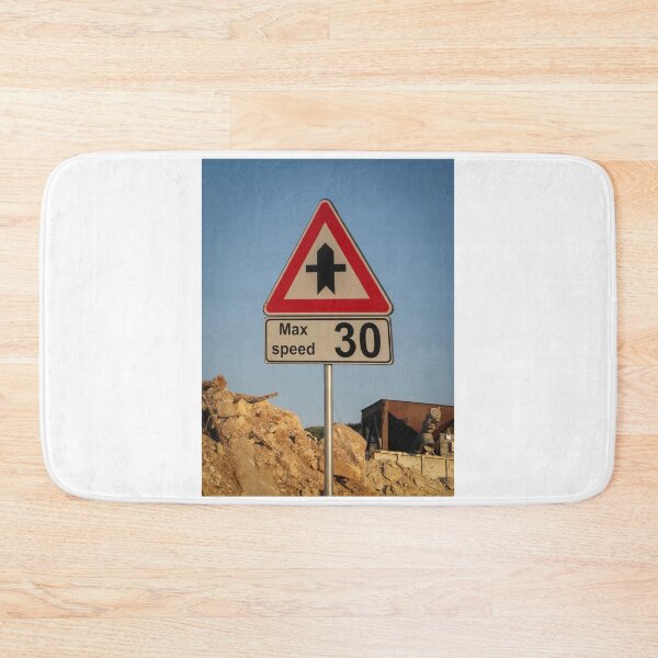 Item preview, Speed Limit 30 Road Sign At Construction Site Under Clear Blue Sky With Rocky Ground designed and sold by Nmallia.
