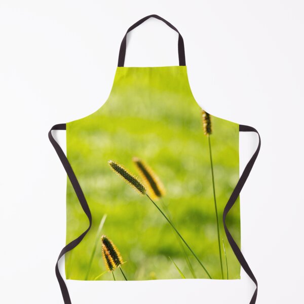 Item preview, Golden grass spikes sway gently under warm sunlight in a lush green field designed and sold by BigBadJogr.