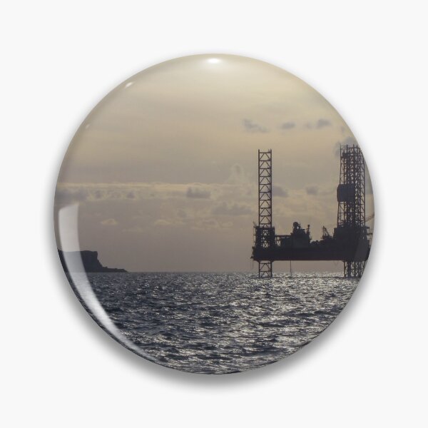 Item preview, Silhouette Of Offshore Oil Rig At Sunset With Small Island On The Horizon designed and sold by Nmallia.