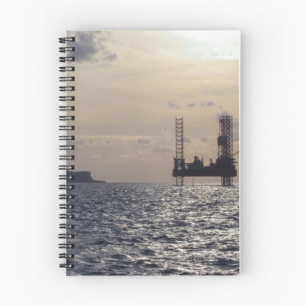Item preview, Silhouette Of Offshore Oil Rig At Sunset With Small Island On The Horizon designed and sold by Nmallia.