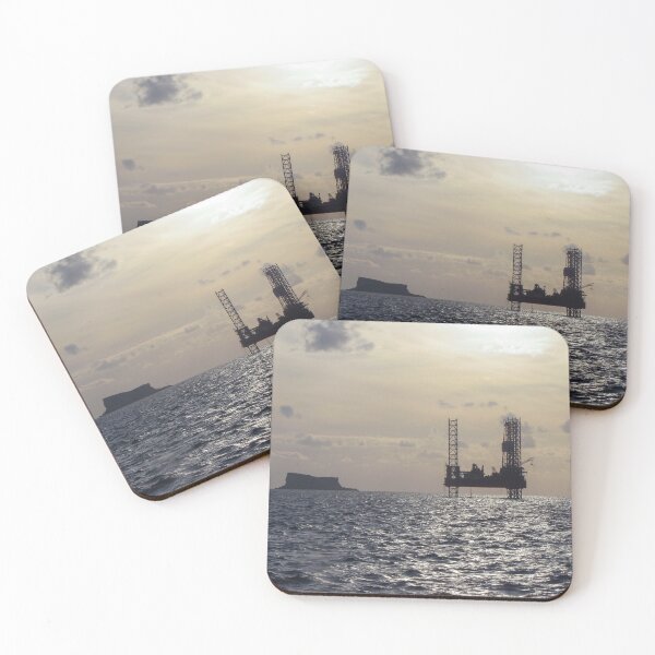 Item preview, Silhouette Of Offshore Oil Rig At Sunset With Small Island On The Horizon designed and sold by Nmallia.