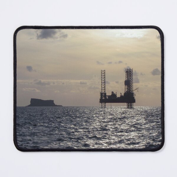 Item preview, Silhouette Of Offshore Oil Rig At Sunset With Small Island On The Horizon designed and sold by Nmallia.