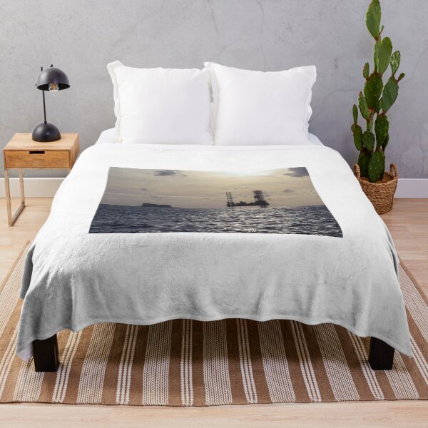Item preview, Silhouette Of Offshore Oil Rig At Sunset With Small Island On The Horizon designed and sold by Nmallia.