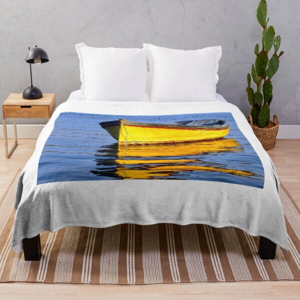 Item preview, Bright Yellow Boat Floats on Calm Blue Water with Golden Reflection designed and sold by Nmallia.