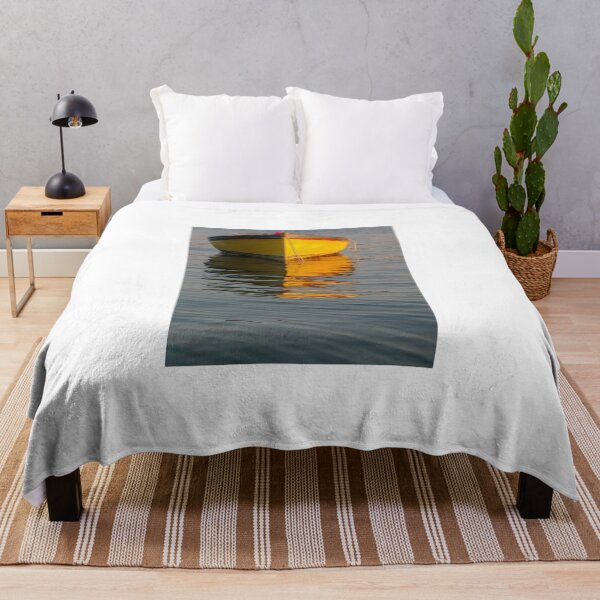 Item preview, Bright Yellow Boat Floats on Calm Blue Water with Golden Reflection designed and sold by Nmallia.