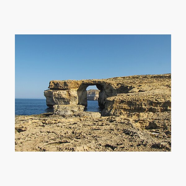 Item preview, Azure Window Arch Along Coastal Cliffs Over The Sea Under Clear Blue Sky designed and sold by Nmallia.