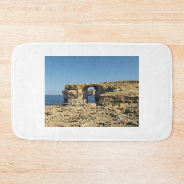 Item preview, Azure Window Arch Along Coastal Cliffs Over The Sea Under Clear Blue Sky designed and sold by Nmallia.
