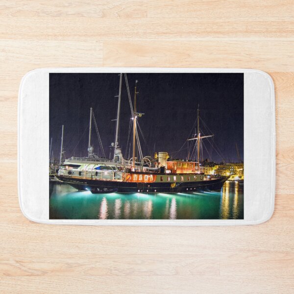 Item preview, Night Yacht in Harbor Bathed in Neon Reflections Amid Glowing City Lights designed and sold by Nmallia.