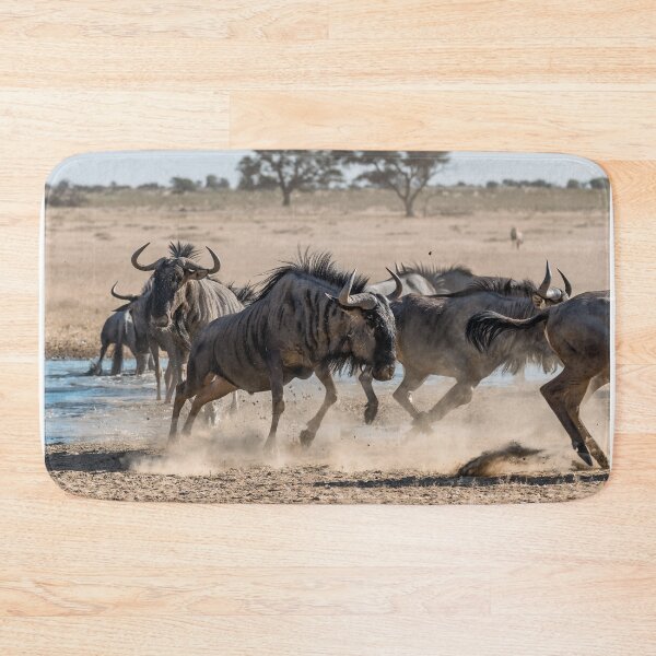 Item preview, Savanna Clash — Wildebeest Kicking Up Dust at the Waterhole designed and sold by DavideAntoniani.
