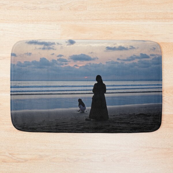 Item preview, Mother and child facing the waves at dusk in Pangandaran designed and sold by franck380.