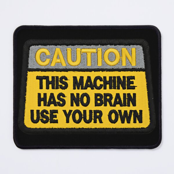 Item preview, Caution This Machine Has No Brain Use Your Own Geek Culture embroidered Warning Sign designed and sold by SkeletonsDanger.