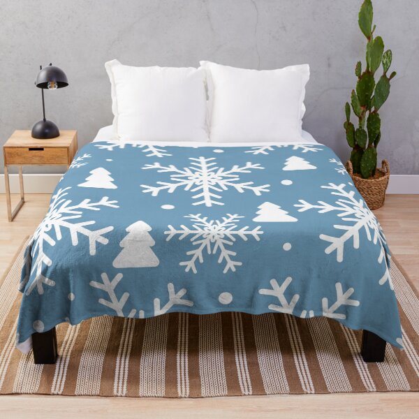 Item preview, Winter with white snowflakes and fir trees on a light blue background Small white dots are scattered designed and sold by Crispifly.