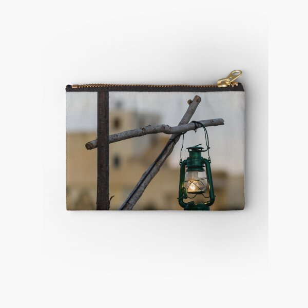 Item preview, Green Lantern Hanging From Rustic Wooden Frame With Blurred Urban Background designed and sold by Nmallia.