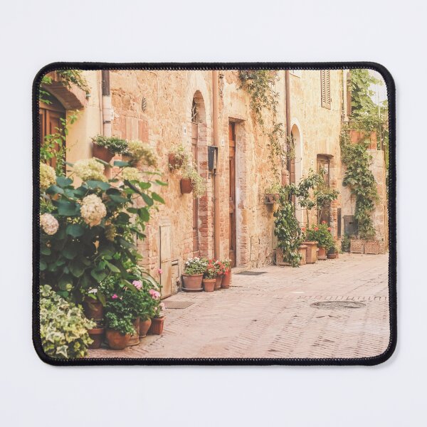 Item preview, Tuscany, Italy I Blooming alley in Pienza village with plants flowers under pastel warm summer light rustic Italian street photography with Mediterranean countryside charm, floral beauty, la dolce vita designed and sold by Julie Travel Photography.
