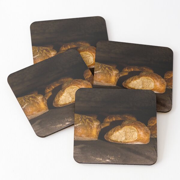Item preview, Warm Baked Bread Rolls Resting On Dark Stone Surface In Low Lighting designed and sold by Nmallia.