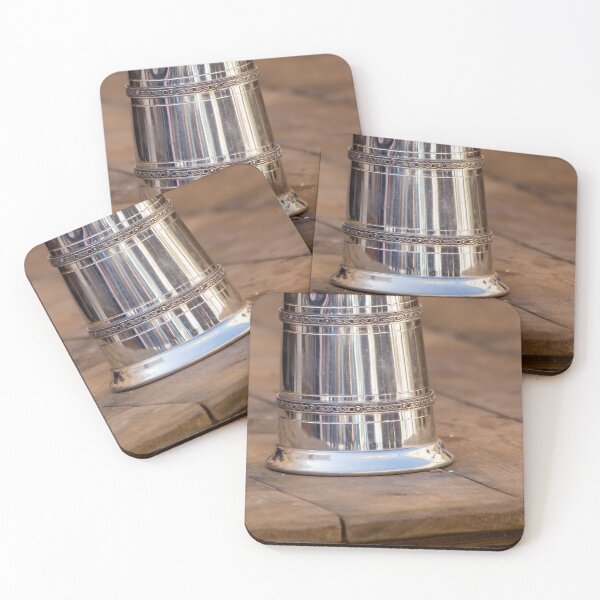 Item preview, Shiny Silver medieval mug With Decorative Band Resting On Rustic Wooden Table Scene designed and sold by Nmallia.