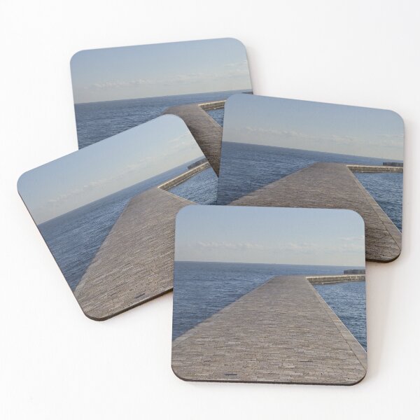 Item preview, Long Stone Pier Reaches Out Into Calm Sea Toward Lighthouse Under Clear Sky designed and sold by Nmallia.