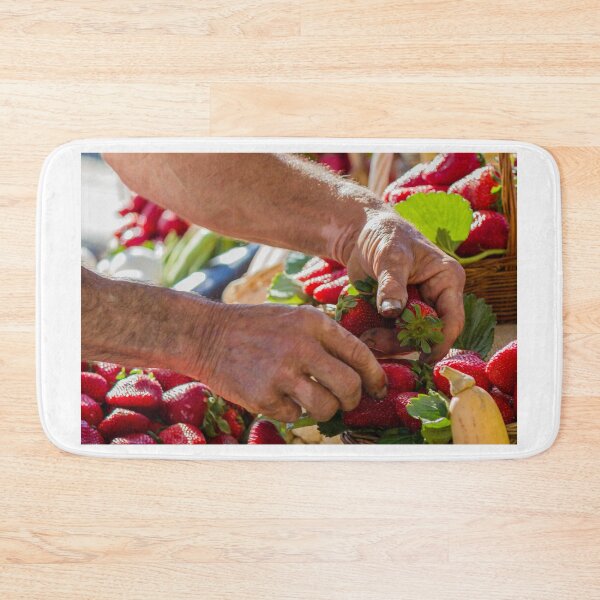 Item preview, Farmer Hands Picking Fresh Strawberries at Outdoor Market Stand with Basket of Fruit designed and sold by Nmallia.