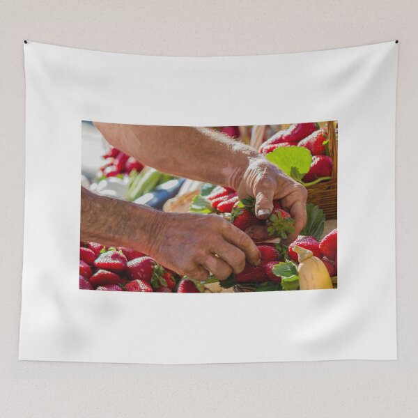Item preview, Farmer Hands Picking Fresh Strawberries at Outdoor Market Stand with Basket of Fruit designed and sold by Nmallia.