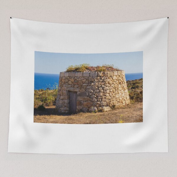 Item preview, Weathered Stone Round Hut by the Sea with Wooden Door and Wild Coastal Garden Scene designed and sold by Nmallia.