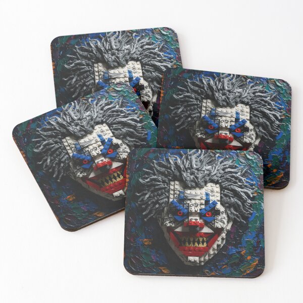 Item preview, Scary clown face with jagged teeth and strong eyes made of colored logo stone with gray hair, white face and blue, green and orange background designed and sold by jotcar.