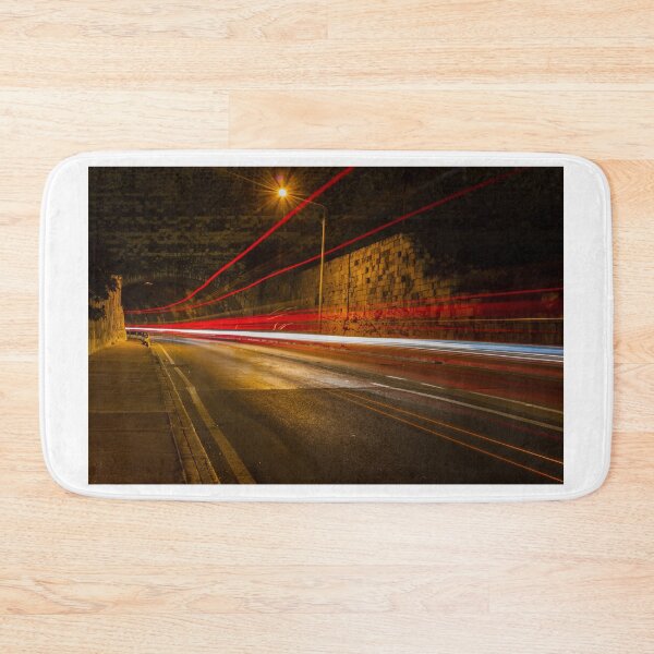 Item preview, Night Street With Light Trails Along Historic Stone Wall, Tunnel Arch, and Street Scene designed and sold by Nmallia.