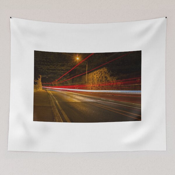 Item preview, Night Street With Light Trails Along Historic Stone Wall, Tunnel Arch, and Street Scene designed and sold by Nmallia.