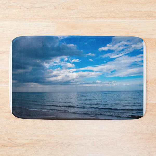 Item preview, Clouds fighting the blue sky over the water designed and sold by KillNFuel.