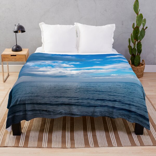 Item preview, Clouds fighting the blue sky over the water designed and sold by KillNFuel.