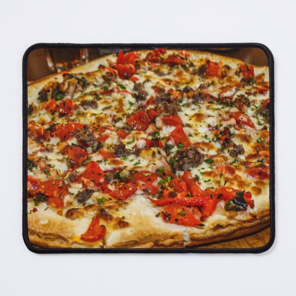Item preview, Delicious Large Pizza With Tomato, Cheese, and Meat Toppings on Wooden Board designed and sold by Nmallia.