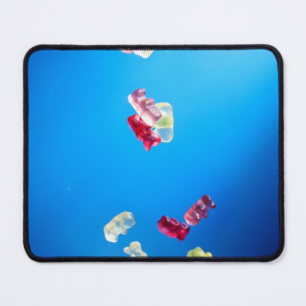 Item preview, Colorful Gummy Bears Falling Into White Bowl Against Bright Blue Background designed and sold by Nmallia.