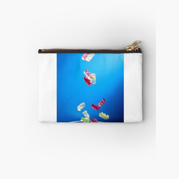 Item preview, Colorful Gummy Bears Falling Into White Bowl Against Bright Blue Background designed and sold by Nmallia.