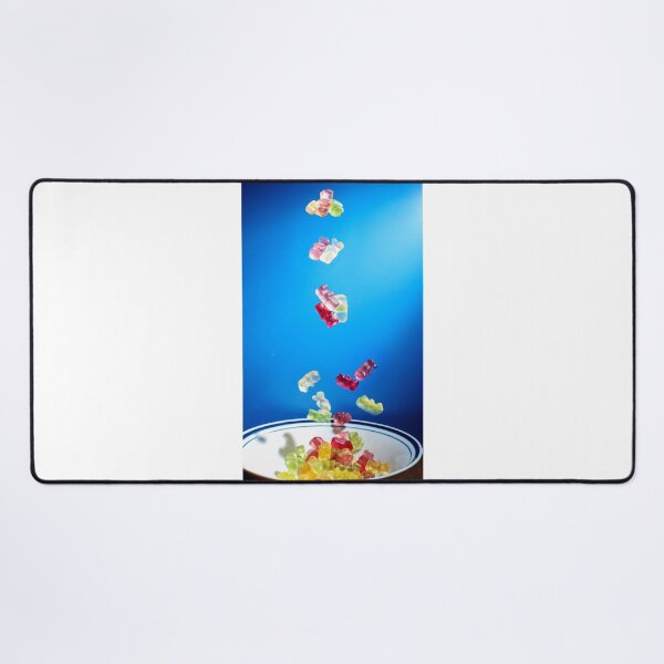 Item preview, Colorful Gummy Bears Falling Into White Bowl Against Bright Blue Background designed and sold by Nmallia.