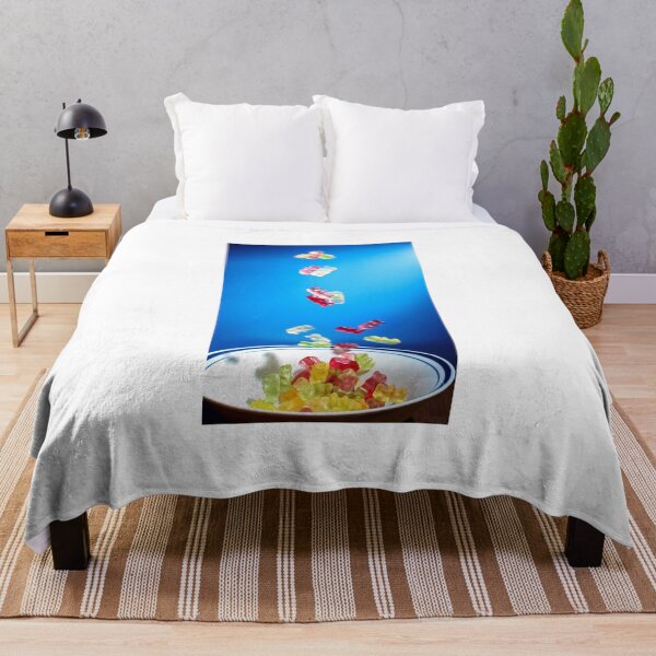 Item preview, Colorful Gummy Bears Falling Into White Bowl Against Bright Blue Background designed and sold by Nmallia.