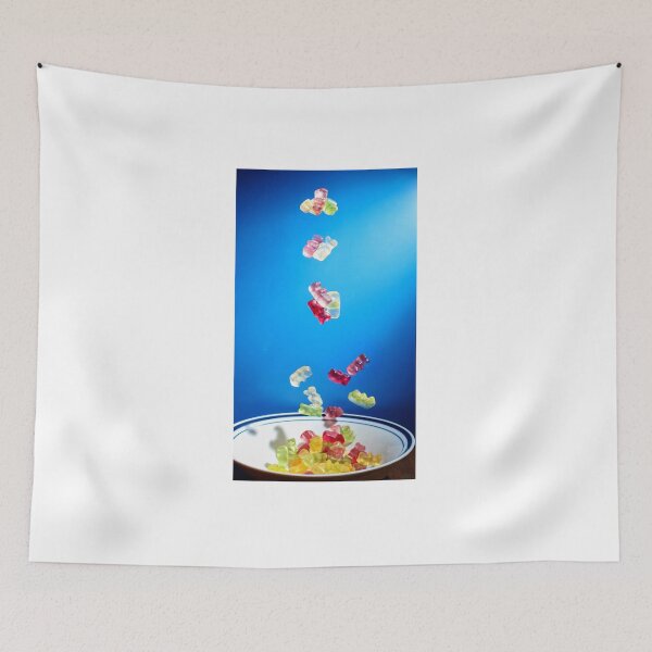 Item preview, Colorful Gummy Bears Falling Into White Bowl Against Bright Blue Background designed and sold by Nmallia.