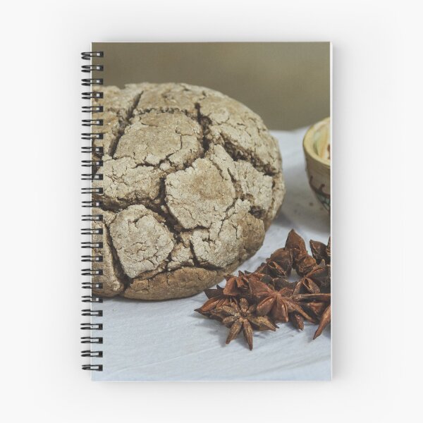 Item preview, Rustic Cracked Bread Loaf With Star Anise And Ceramic Cup On White Tablecloth designed and sold by Nmallia.