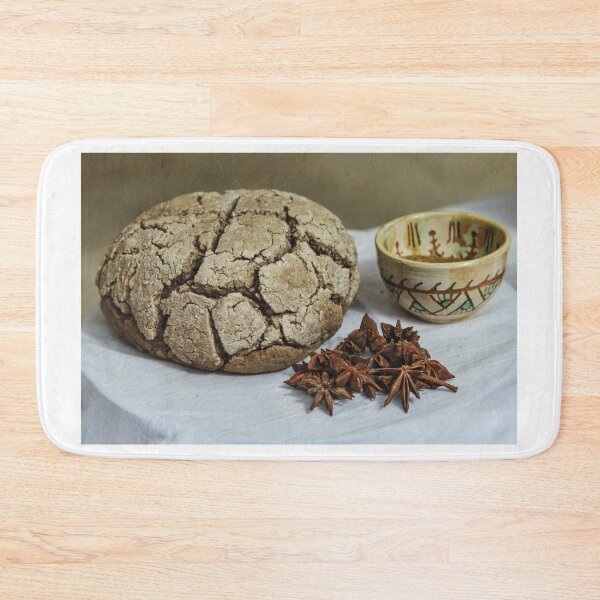 Item preview, Rustic Cracked Bread Loaf With Star Anise And Ceramic Cup On White Tablecloth designed and sold by Nmallia.