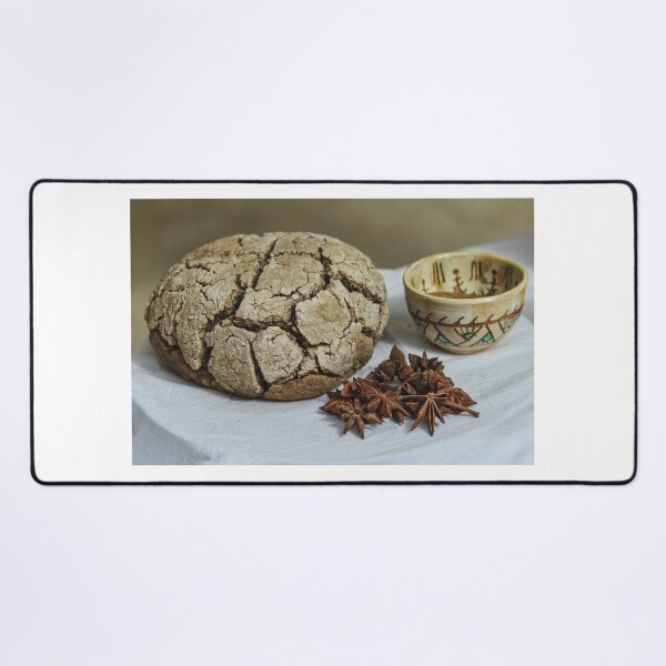 Item preview, Rustic Cracked Bread Loaf With Star Anise And Ceramic Cup On White Tablecloth designed and sold by Nmallia.