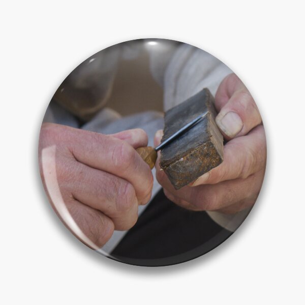 Item preview, Craftsman Sharpening Knife With Whetstone In Workshop: Close-Up Of Focused Hands designed and sold by Nmallia.